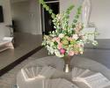 Our florist worked so hard on this stunning centerpiece with custom invitations designed by Delta Party.