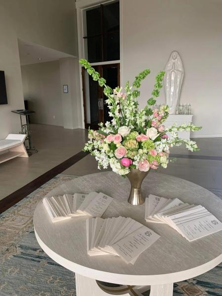 Our florist worked so hard on this stunning centerpiece with custom invitations designed by Delta Party.